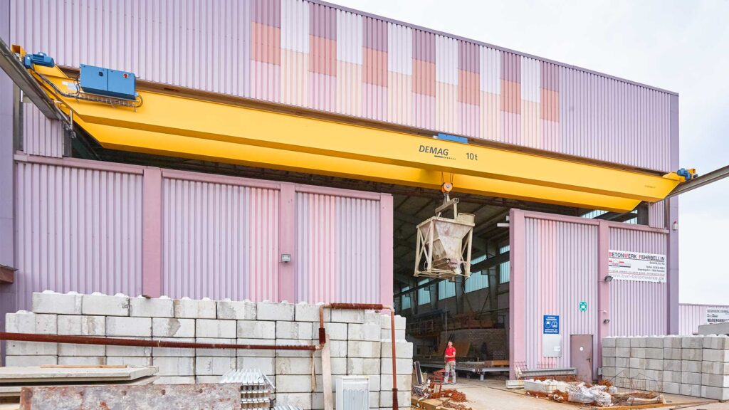 Demag double girder crane with Demag wire rope hoist in a hybrid indoor and outdoor applicaiton.