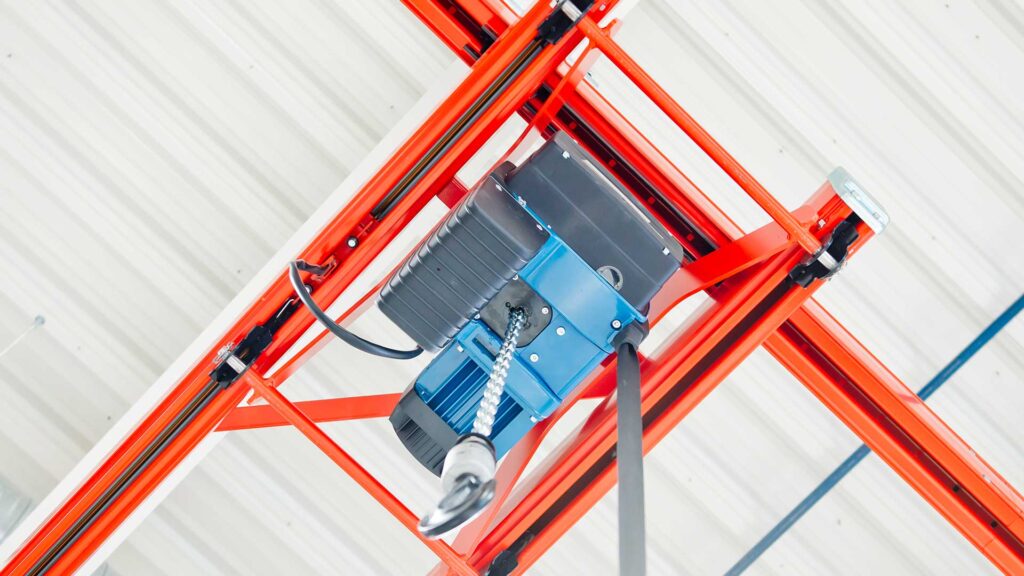 Viewing a Demag DC chain hoist from the floor looking up to see the 7 segment display.