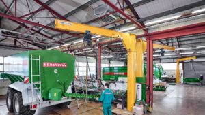 Demag jib crane used with a DC chain hoist to complete a production process in vehicle manufacturing.